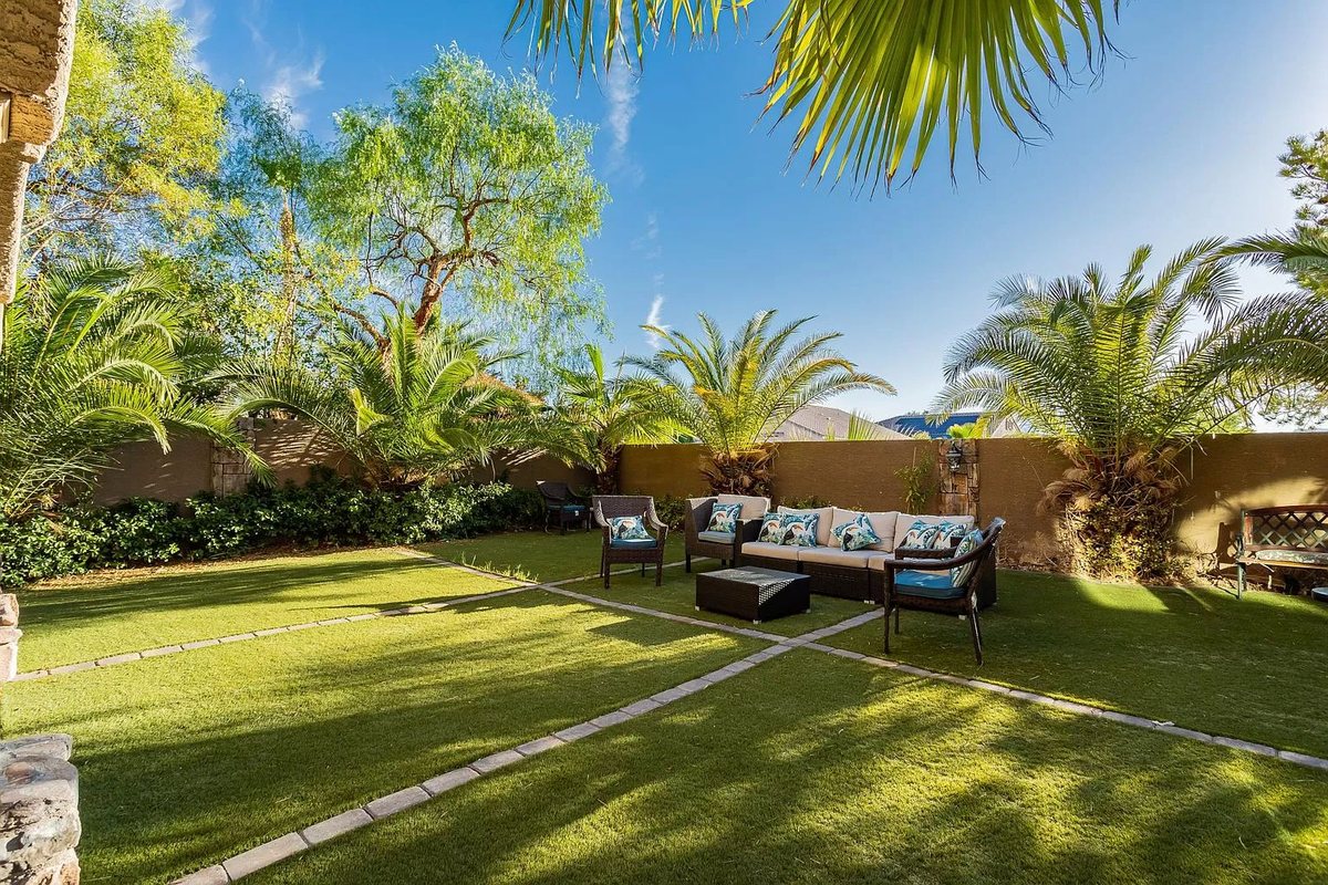 Covered patio opening to a private lawn