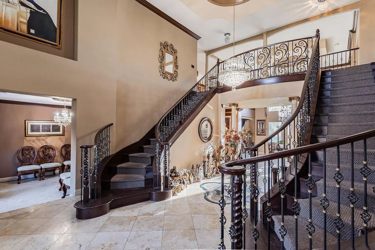 Grand iron staircase inside Mansion No. 01, a luxury Las Vegas estate rental