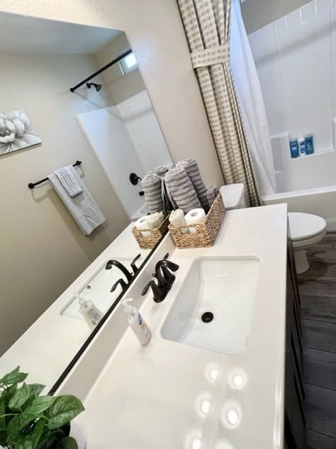 Hotel-style bathroom with fresh towels and toiletries