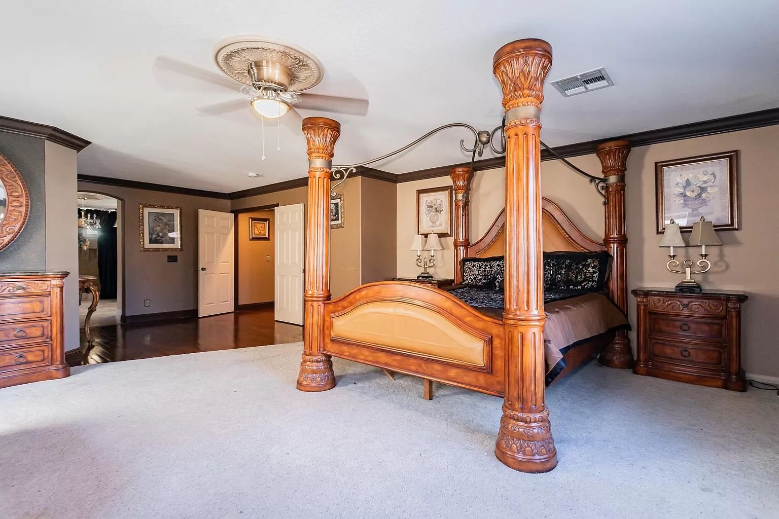 Columned master suite with canopy bed